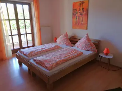 Ein Bett oder Betten in einem Zimmer der Unterkunft Gästehaus Am Sonnenhang
