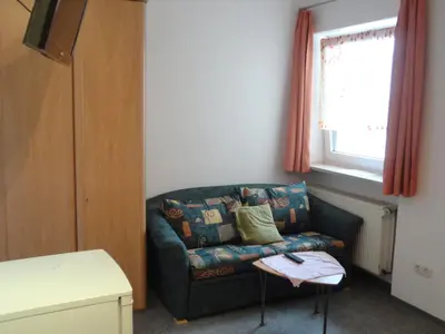 Ein Sitzbereich in der Unterkunft Gasthof Reif