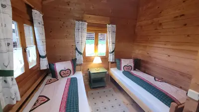 Ein Bett oder Betten in einem Zimmer der Unterkunft Blockhaus mit WLAN Bayern
