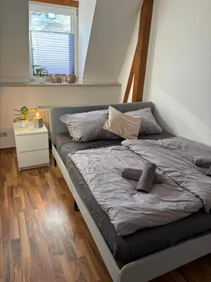 Ein Bett oder Betten in einem Zimmer der Unterkunft komfortable Ferienwohnung am Stadtwald von Plauen