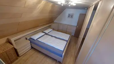 Ein Bett oder Betten in einem Zimmer der Unterkunft Ferienhaus am großen Waldstein
