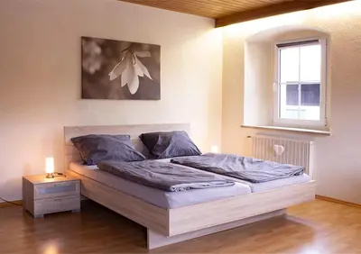 Ein Bett oder Betten in einem Zimmer der Unterkunft Schöne Ferienwohnung mit großer Terrasse.