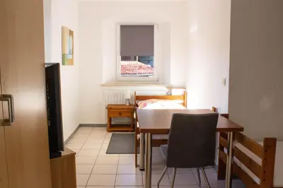 Ein Sitzbereich in der Unterkunft Einladene Fremdenzimmer mit Außengastronomie