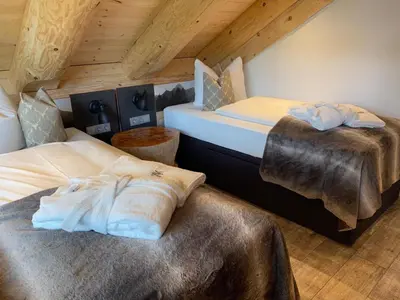 Ein Bett oder Betten in einem Zimmer der Unterkunft Waldstein Chalet