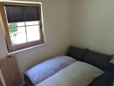 Ein Bett oder Betten in einem Zimmer der Unterkunft Ferienwohnung und Sommerhaus unter der Burg