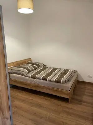 Ein Bett oder Betten in einem Zimmer der Unterkunft Apartment in zentraler Lage mit Privatparkplatz
