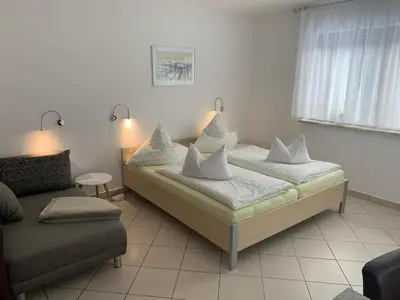 Ein Bett oder Betten in einem Zimmer der Unterkunft Ferienwohnungen Börnert am 