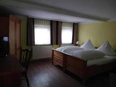 Ein Bett oder Betten in einem Zimmer der Unterkunft Hotel Jägerhalle