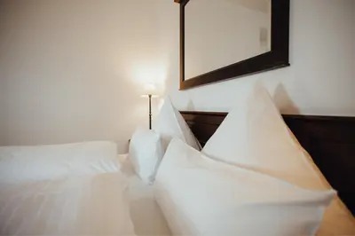 Ein Bett oder Betten in einem Zimmer der Unterkunft Hotel 