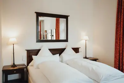 Ein Bett oder Betten in einem Zimmer der Unterkunft Hotel 