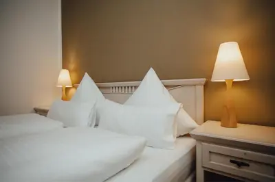 Ein Bett oder Betten in einem Zimmer der Unterkunft Hotel 