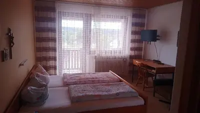 Ein Bett oder Betten in einem Zimmer der Unterkunft Landgasthof Schmidbauer