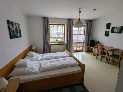 Ein Bett oder Betten in einem Zimmer der Unterkunft Cafe-Bäckerei-Pension Weigl