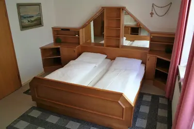 Ein Bett oder Betten in einem Zimmer der Unterkunft Cafe-Bäckerei-Pension Weigl