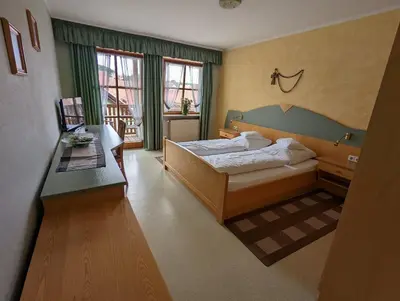 Ein Bett oder Betten in einem Zimmer der Unterkunft Cafe-Bäckerei-Pension Weigl