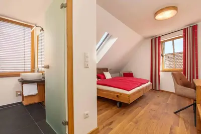 Ein Bett oder Betten in einem Zimmer der Unterkunft Hotel Garni zum Schwan