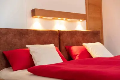 Ein Bett oder Betten in einem Zimmer der Unterkunft Hotel Garni zum Schwan