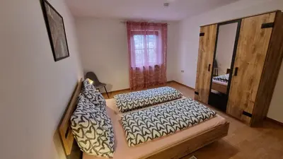 Ein Bett oder Betten in einem Zimmer der Unterkunft Germanus Ferienwohnung
