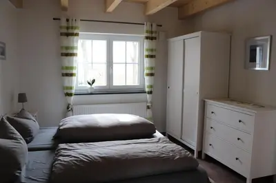 Ein Bett oder Betten in einem Zimmer der Unterkunft Ferienwohnung Leimitz