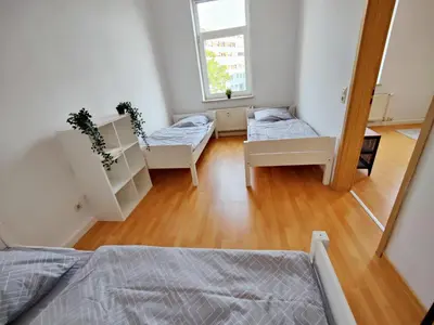 Ein Bett oder Betten in einem Zimmer der Unterkunft YourFavoriteBed Designwohnung Nähe Zentrum und Klinikum