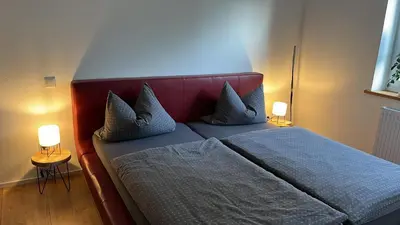 Ein Bett oder Betten in einem Zimmer der Unterkunft Schiller Apartment