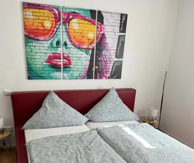 Ein Bett oder Betten in einem Zimmer der Unterkunft Schiller Apartment