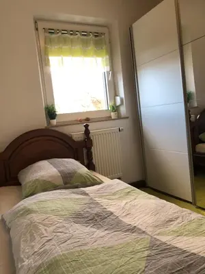 Ein Bett oder Betten in einem Zimmer der Unterkunft Fine Ferienwohnung Bayreuth