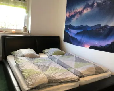Ein Bett oder Betten in einem Zimmer der Unterkunft Fine Ferienwohnung Bayreuth