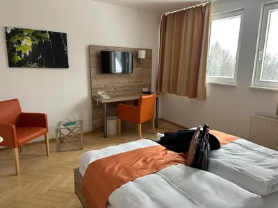 Ein Bett oder Betten in einem Zimmer der Unterkunft Hotel Haus am Ahorn