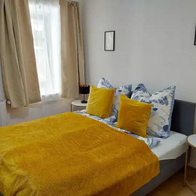Ein Bett oder Betten in einem Zimmer der Unterkunft Gemütliche Wohnung mit Küche und Netflix