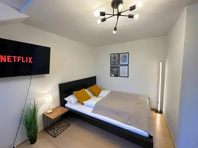 Ein Bett oder Betten in einem Zimmer der Unterkunft Gemütliche, charmante Ferienwohnung Nähe Zentrum
