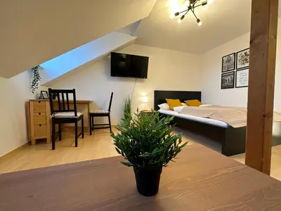 Ein Bett oder Betten in einem Zimmer der Unterkunft Gemütliche, charmante Ferienwohnung Nähe Zentrum