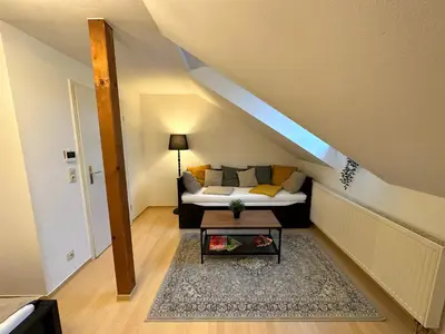 Ein Bett oder Betten in einem Zimmer der Unterkunft Gemütliche, charmante Ferienwohnung Nähe Zentrum