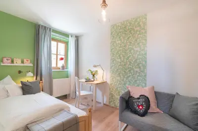 Ein Bett oder Betten in einem Zimmer der Unterkunft Roomerie