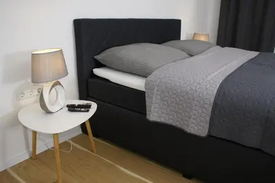 Ein Bett oder Betten in einem Zimmer der Unterkunft APARTMENT SONNE Reusa