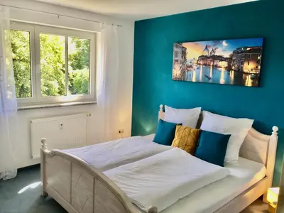 Ein Bett oder Betten in einem Zimmer der Unterkunft Schöne Gartenwohnung im Seenland
