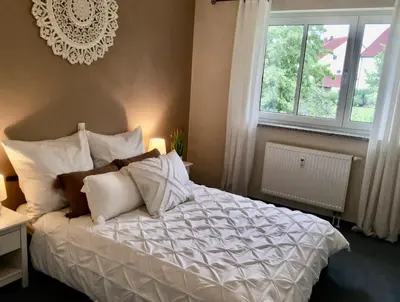 Ein Bett oder Betten in einem Zimmer der Unterkunft Schöne Gartenwohnung im Seenland