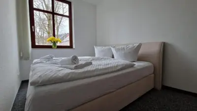 Ein Bett oder Betten in einem Zimmer der Unterkunft Markt 9 Appartements Oberwiesenthal