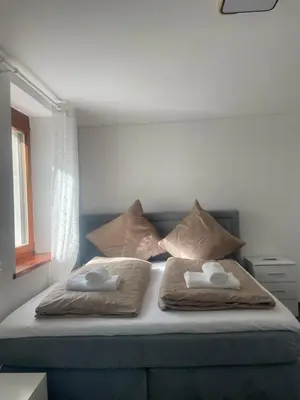 Ein Bett oder Betten in einem Zimmer der Unterkunft Diyo Apart Festspiel Bayreuth