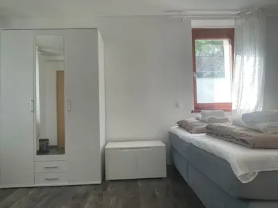 Ein Bett oder Betten in einem Zimmer der Unterkunft Diyo Apart Festspiel Bayreuth