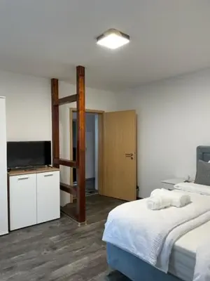 Ein Bett oder Betten in einem Zimmer der Unterkunft Diyo Apart Festspiel Bayreuth
