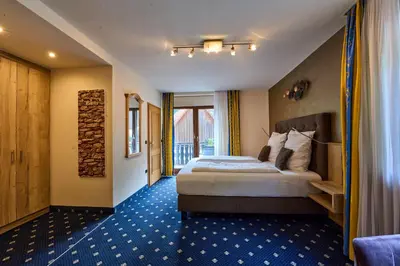 Ein Bett oder Betten in einem Zimmer der Unterkunft Gästehaus Forellenhof
