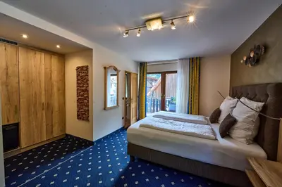 Ein Bett oder Betten in einem Zimmer der Unterkunft Gästehaus Forellenhof