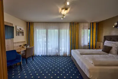 Ein Bett oder Betten in einem Zimmer der Unterkunft Gästehaus Forellenhof