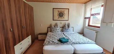 Ein Bett oder Betten in einem Zimmer der Unterkunft Gasthaus Zum Schneider