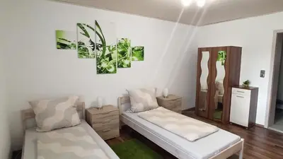 Ein Bett oder Betten in einem Zimmer der Unterkunft Ferienwohnung Im Vilstal