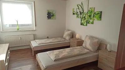 Ein Bett oder Betten in einem Zimmer der Unterkunft Ferienwohnung Im Vilstal