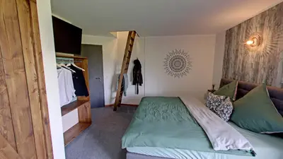 Ein Bett oder Betten in einem Zimmer der Unterkunft Brauhaisla