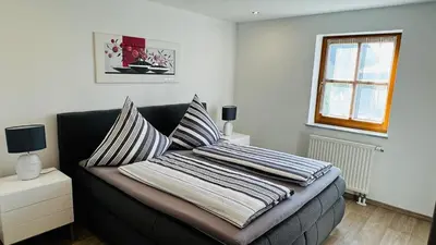 Ein Bett oder Betten in einem Zimmer der Unterkunft FeWo - Im SCHWARZACHTAL
