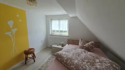 Ein Bett oder Betten in einem Zimmer der Unterkunft Ferienhaus Bringfriede